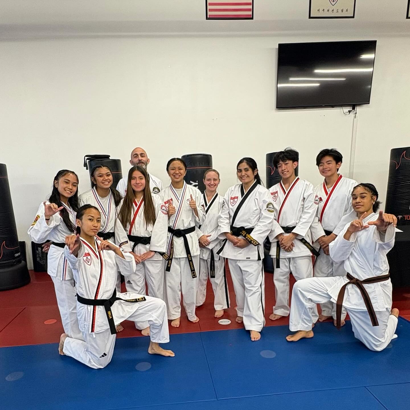 Adult black belts training striking technique at Results Martial Arts